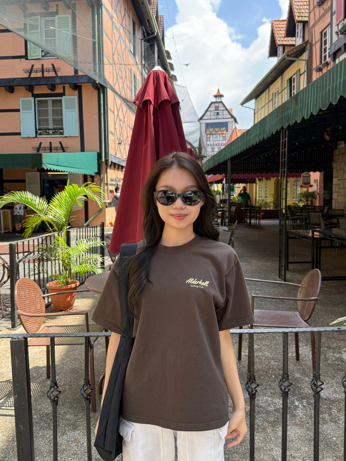 Alderhall Golf Expresso Tee Worn by Model in Colmar France Village