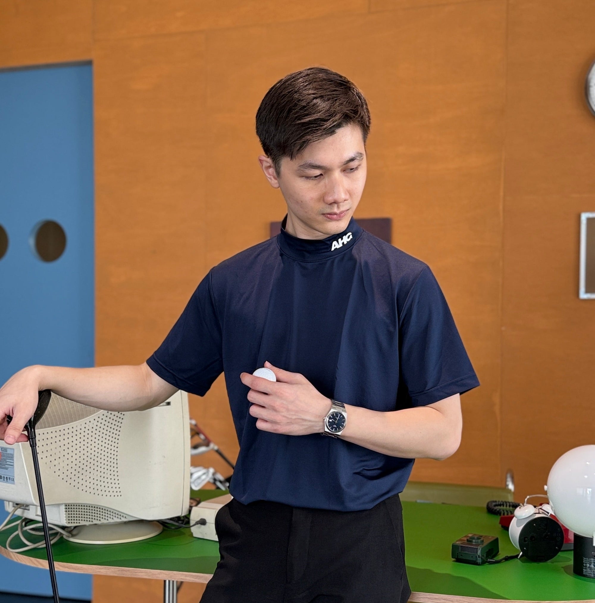 Alderhall Golf Midnight Mock Neck Shirt Worn by Model in Office Front View