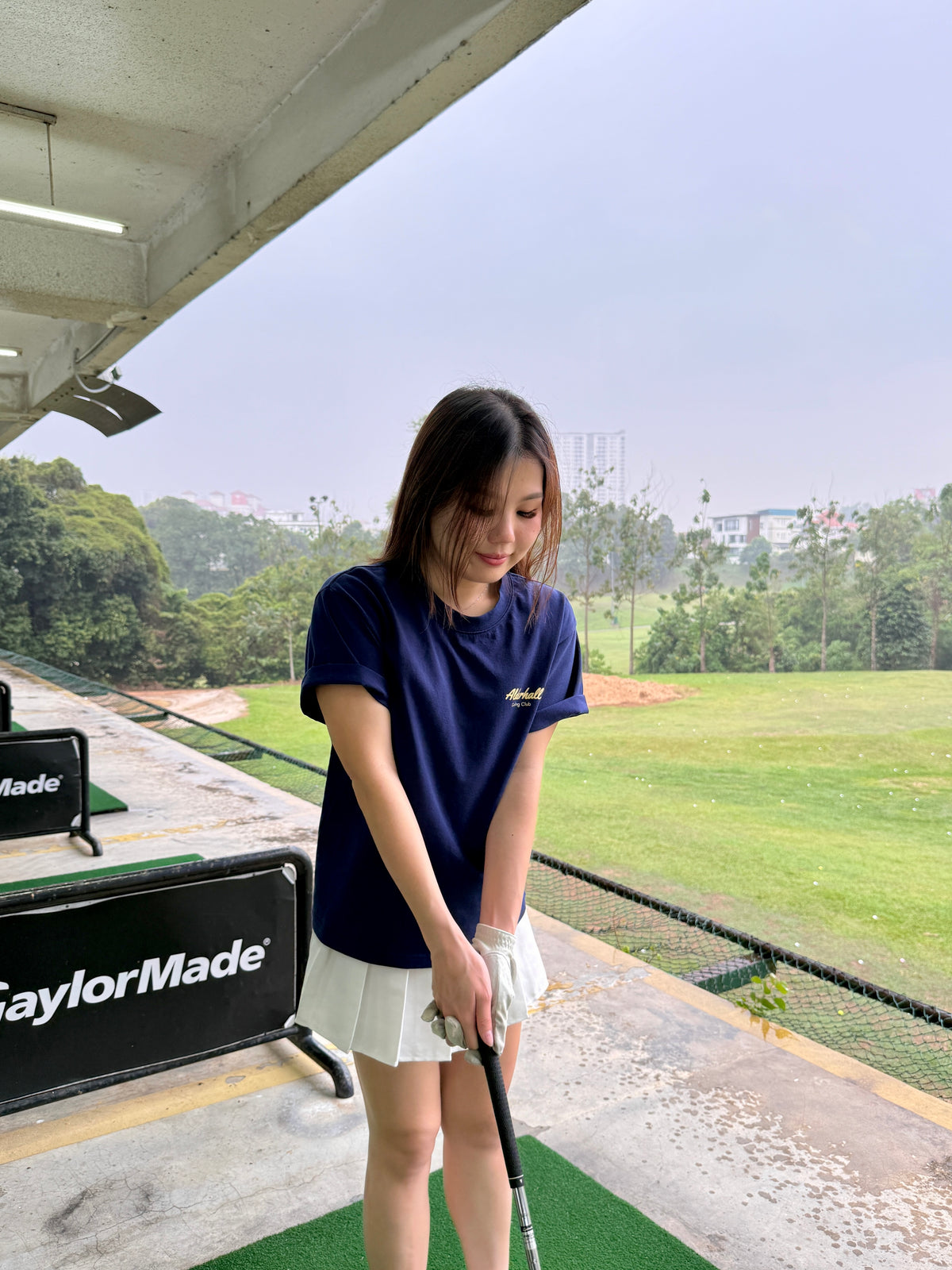 Alderhall Golf Water Hazard Tee Worn by Model in Driving Range